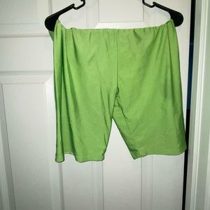 Neon green biker shorts, small oil stain